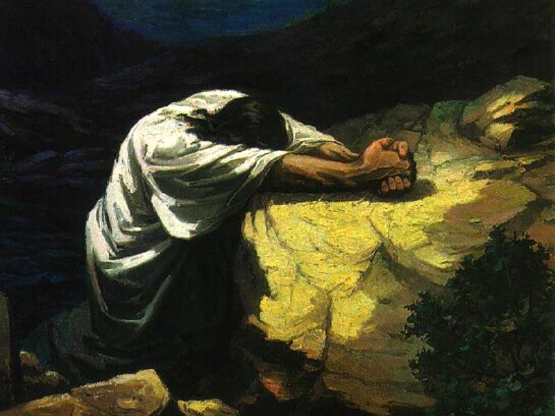 Jesus prays to God in the Garden of Gethsemane