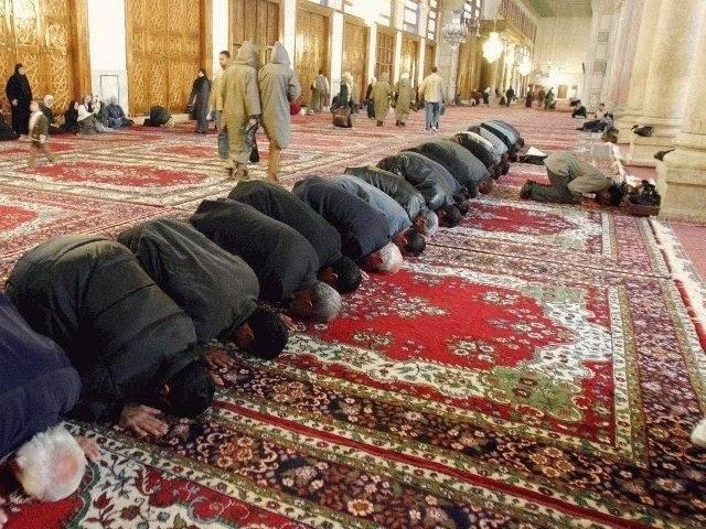 Muslims praying in a Mosque