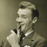 smug man with pipe in mouth